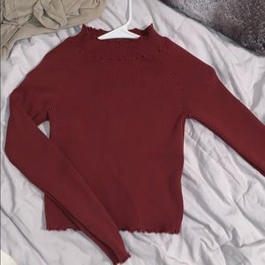 Ruffled detailing turtle neck